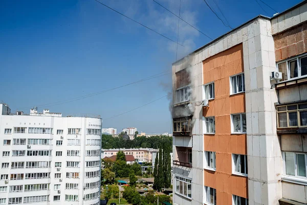 fire on the balcony of a multi-storey building, black clouds of smoke, apartment smoke, extinguishing fire in a residential building, fire escape, emergency, fire, open fire, house fire