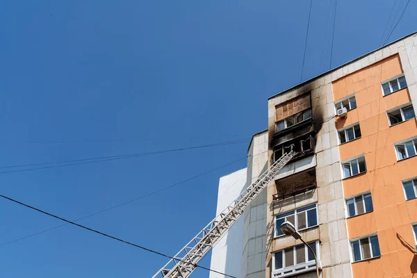 fire on the balcony of a multi-storey building, black clouds of smoke, apartment smoke, extinguishing fire in a residential building, fire escape, emergency, fire, open fire, house fire