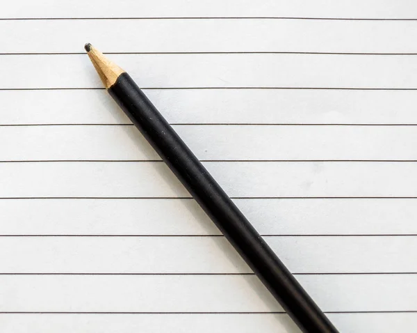 Black Pencil Laying Top White Paper Black Lines — Stock Photo, Image