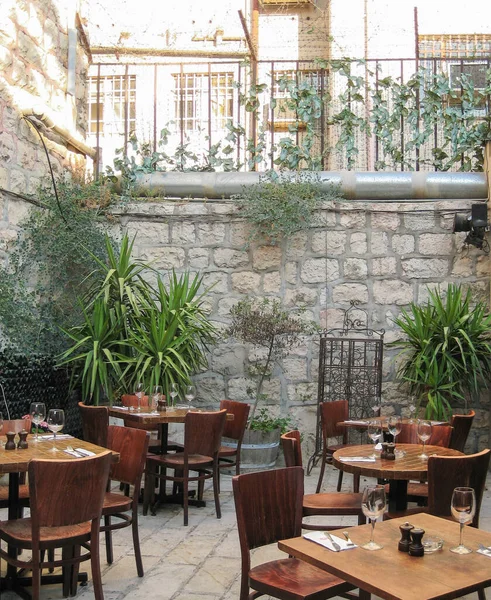 Outside dining on a patio in an urban building,