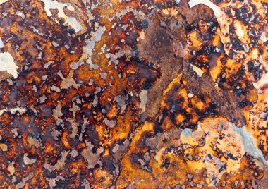 Ferrous, paslı taş plakanın soyut deseni yakın planda.