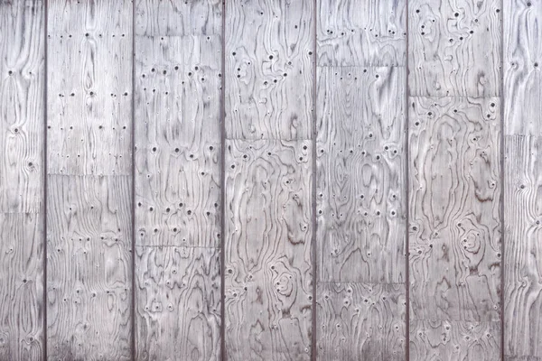 Gray wood texture of a wall paneling with intensive grain