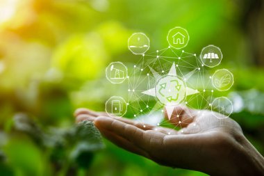 Çevre simgeleriyle el ele tutuşan teknoloji, yeşil arkaplanda Ağ bağlantısı üzerinden.