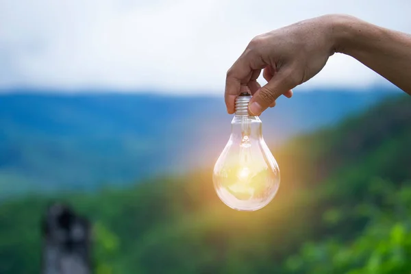 Hand Holding Light Bulb Nature Icons Energy Sources Renewable — Stock Photo, Image