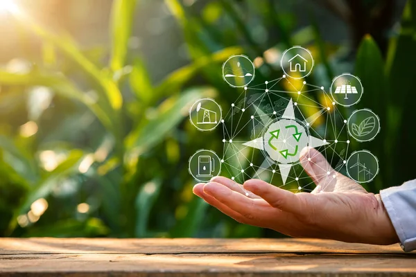 Çevre simgeleriyle el ele tutuşan teknoloji, yeşil arkaplanda Ağ bağlantısı üzerinden.