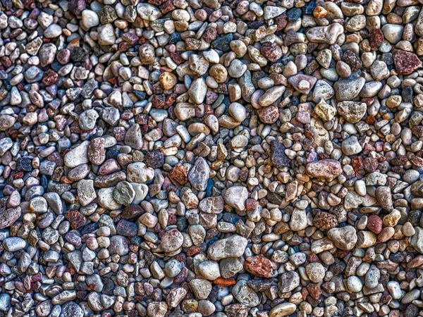 Pebble lies evenly on the seashore. — Stock Photo, Image