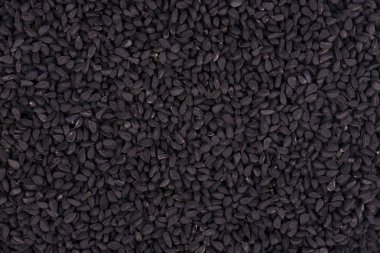 Siyah kimyon tohumu. Nigella sativa. Closeup arka plan.