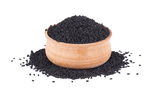 Semillas de comino negro en cuenco de madera, aisladas sobre fondo blanco. Nigella sativa . —  Fotos de Stock