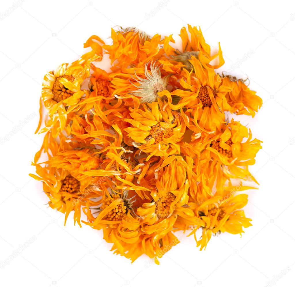 Dried calendula flowers isolated on white background. Medicinal herbs. Top view.