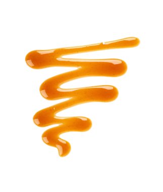 Karamel şurubu damlabeyaz arka plan üzerinde izole. Tatlı karamel sosu sıçramaları. Üstte görüntü.