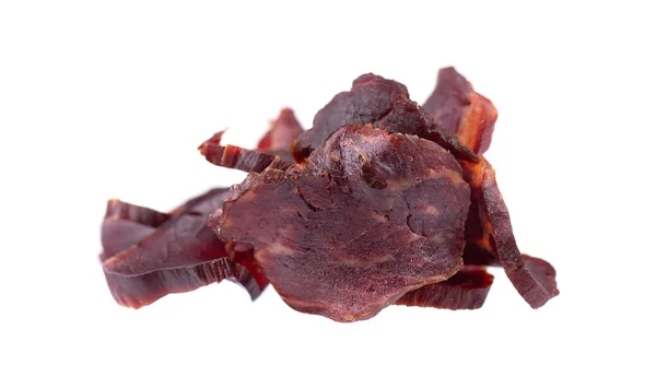 Beef jerky isolated on white background. Pieces of dry meat. Close-up. Clipping path. — Stock Photo, Image