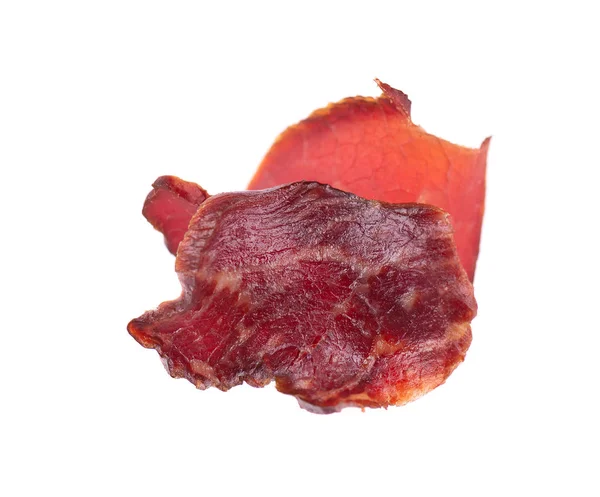 Pork jerky isolated on white background. Pieces of dry meat. Close-up. Clipping path. — Stock Photo, Image