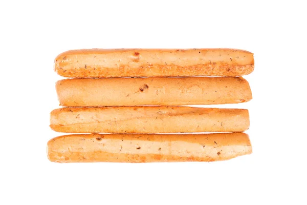 Palitos de pan aislados sobre fondo blanco. Grissini, palitos de pan italianos con cebolla y hierbas. Vista superior. — Foto de Stock