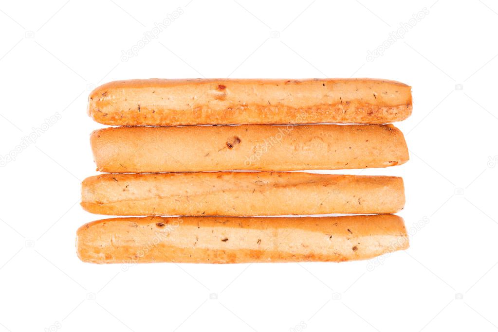 Bread sticks isolated on white background. Grissini, Italian breadsticks with onions and herbs. Top view.