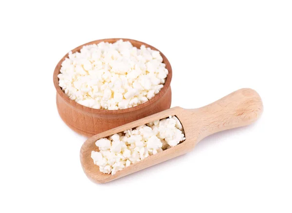 Cottage cheese in a wooden bowl isolated on a white background. — Stock Photo, Image