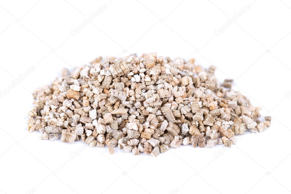 Exfoliated vermiculite mineral, isolated on white background. Mineral used in gardening.