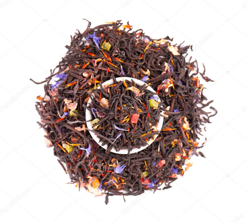 Black Ceylon tea with candied fruit, saffron, rose and cornflower petals, isolated on white background. Organic tea. Top view. Close up