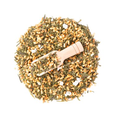 Japanese green tea Genmaicha, isolated on white background. Tea leaves with roasted brown rice. Organic tea. Top view. Close up clipart