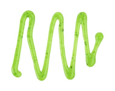 Pistachio reçel yağmuru beyaz arka planda izole edilmiş. Yeşil reçel damlaları. Üst görünüm