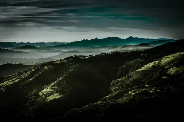 mountains surrounded by fog and gray sky of northern spain