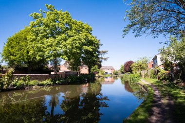 Peaceful village canal scene clipart