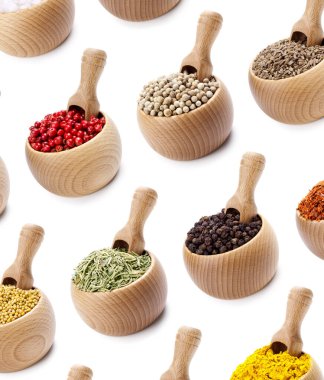 Various spices in wooden pots clipart