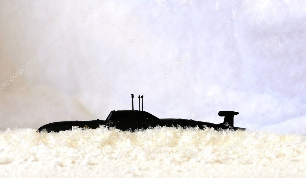 Black submarine against a white background