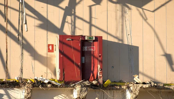 Internal door exposed in a demolished factory