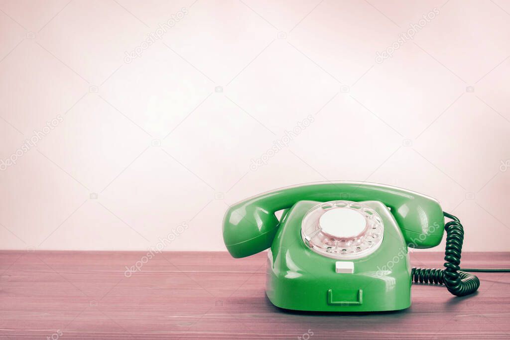 Old fashioned green dial telephone