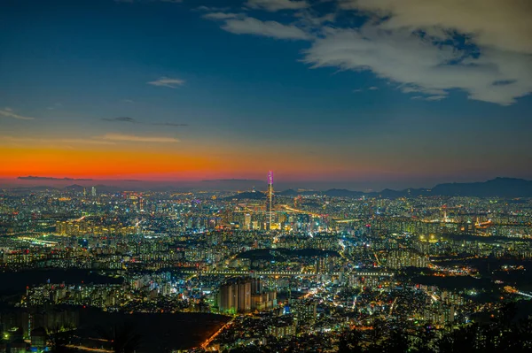 view of twilight seoul city scape showing landmark Seoul tower and lotte tower in the financial district