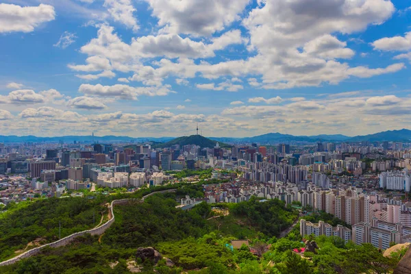 Iconic view of city of seoul Tower with beautiful scattered clouds on a summer  morning. seoul city. south korea