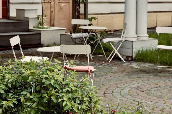 street cafe on the garden or park with chairs and table