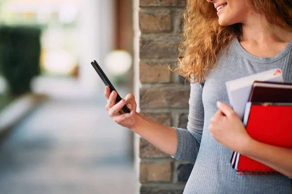 Close Female Profesor Hands Holding Books Using Smart Phone Background — Stock Photo, Image