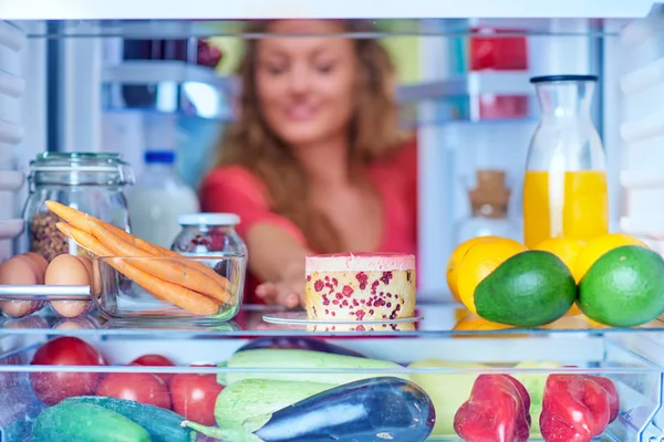 Woman Taking Gateau Form Fridge Full Groceries Unhealthy Eating Concept — Stock Photo, Image