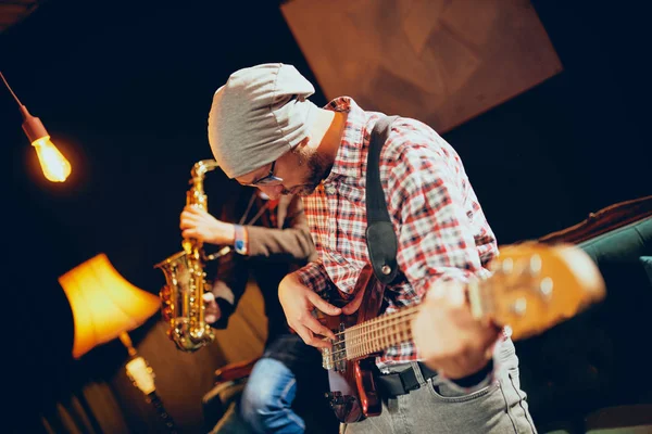 Young Caucasian Man Hat Head Playing Bass Guitar While Sitting — Stock Photo, Image