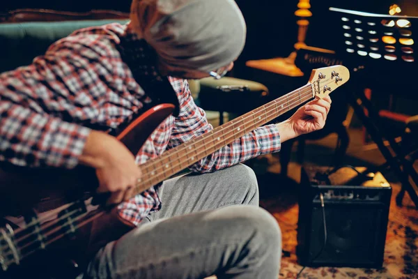 Young Caucasian Man Hat Head Playing Bass Guitar While Sitting — Stock Photo, Image