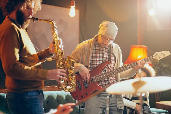 Young Caucasian Man Hat Head Playing Bass Guitar While Sitting — Stock Photo, Image