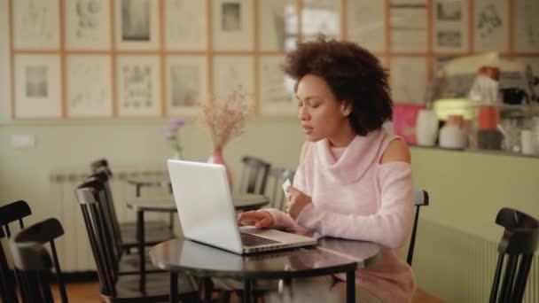 Beautiful Mixed Race Woman Pink Turtleneck Sweater Using Laptop Credit — Stock Video