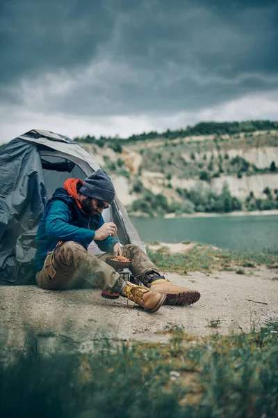 Young Attractive Bearded Smiling Man Sitting Tent Camping Trip Eating — Stock Photo, Image