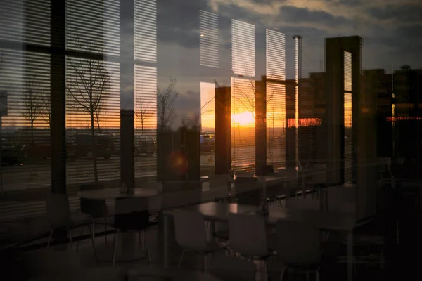 modern dining room in empty office building with sunset flare effect