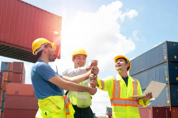 Group Three Workers Wearing Safety Equipment Joining Fist Support Together Stock Picture