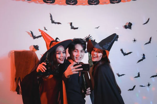 People going to Halloween party with spooky costume, makeup scary face, having fun at Halloween party by celebration