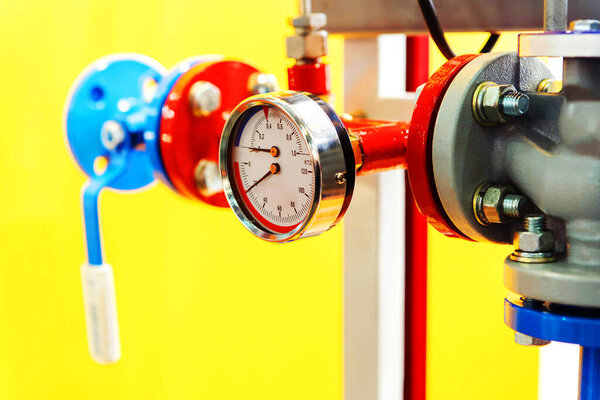 Pressure and temperature sensor in the hot water system. Fragment of a modern boiler room close-up