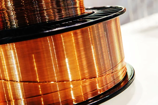 Large coil with copper wire. Production and sale of non-ferrous metal products. Close-up