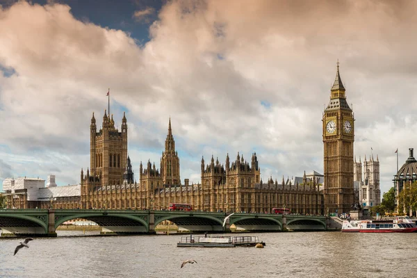 Parliament and Big Ben from the embankments of the River Thames as well as Westminster Bridge in London in England in the United Kingdom