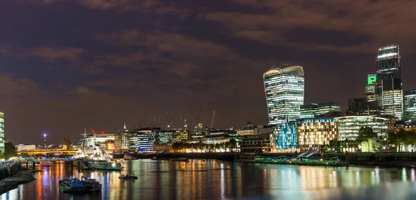 The City and the banks of the Thames in London at night in England in the United Kingdom