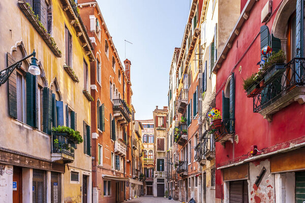 Typical narrow alley in Venice in Veneto, Italy