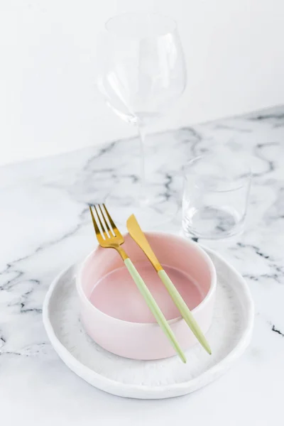 Stylish elegant table setting with ceramic plates on white marble background