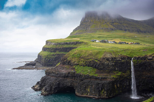 sunny day in waterfall of Faroe Islands