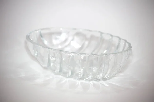 Glass Deep Plate Stands White Background Light Refracted Engraving Dishes — Stock Photo, Image